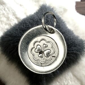 Sterling Silver Round Pendant with a Flower and 4 Hearts Inside the Circle 0.30"